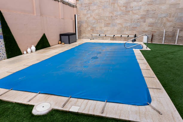 Family enjoying their pool with a safety cover installed